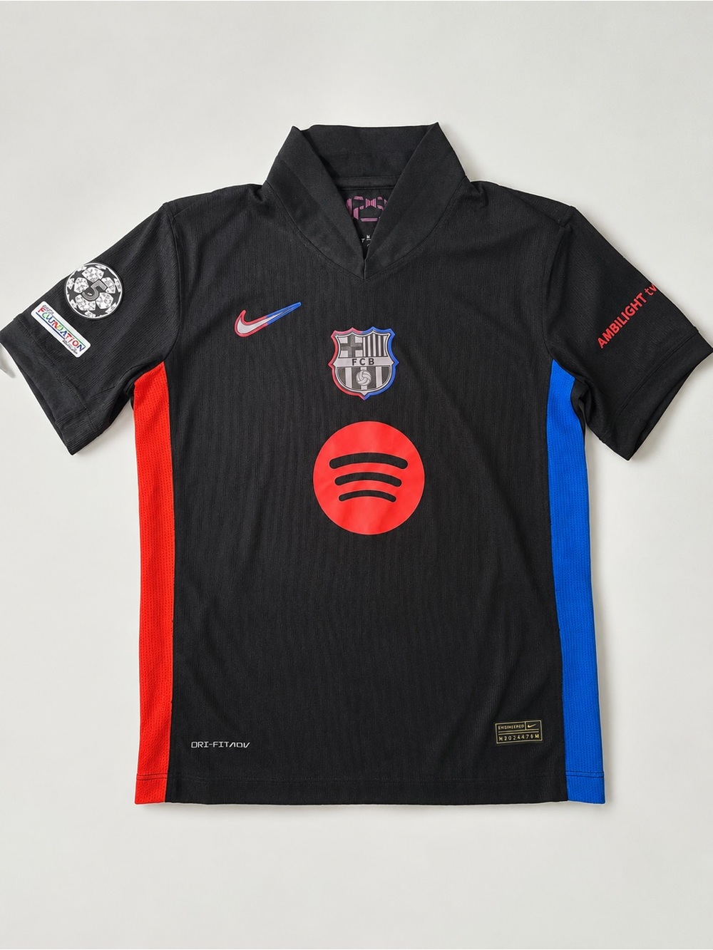 Nike Kids Black Soccer Jersey with Red & Blue Accents